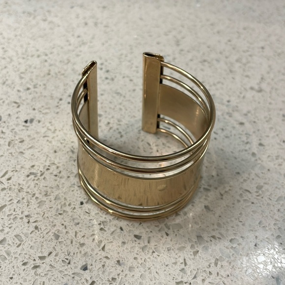 Stylish Shiny Aldo Gold Slip On Bangle Bracelet With Cut Outs - Picture 5 of 7